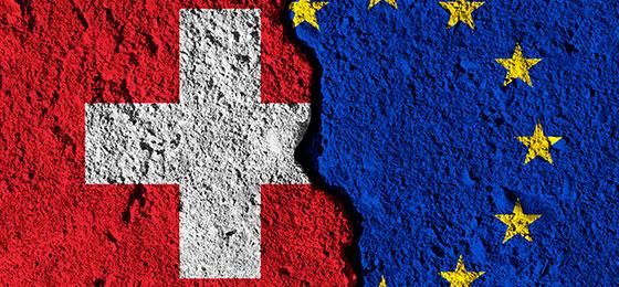 The picture shows the flags of Switzerland and Europe.